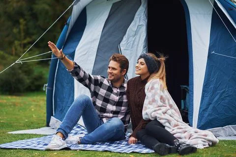 Young nice couple having fun on camping Stock Photos