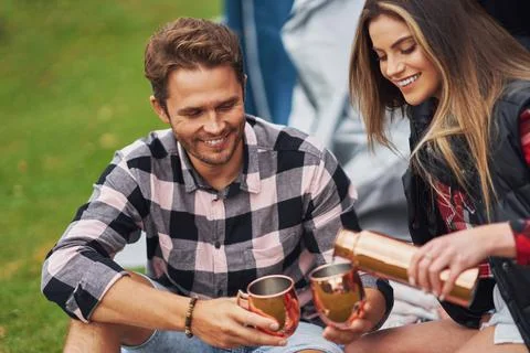 Young nice couple having fun on camping Stock Photos