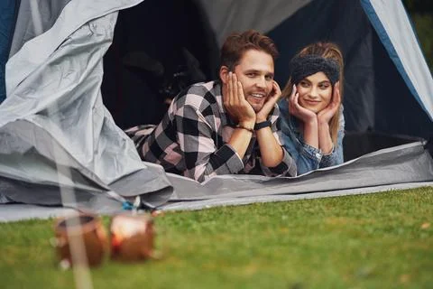 Young nice couple having fun on camping Stock Photos