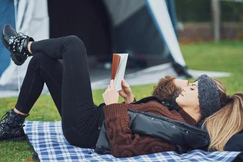 Young nice couple having fun on camping Stock Photos