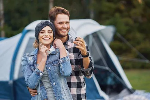 Young nice couple having fun on camping Stock Photos