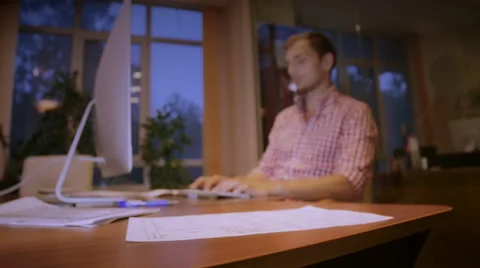 The young, nice guy is very concentrated looks for something in the Internet Video stock 58015479