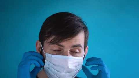 Young nice man with beard close up. Quarantine by covid-19 virus. Slow motion Stock-Footage 129979042