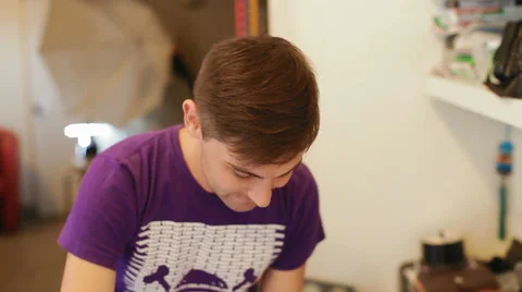 Young, nice man working in the studio Stock Footage 29675482