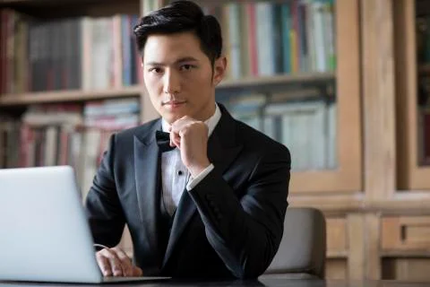 Young nobleman using laptop in the study Stock Photos