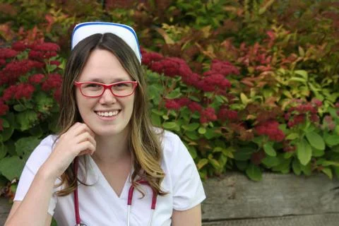 Young nurse with cap Stock Photos