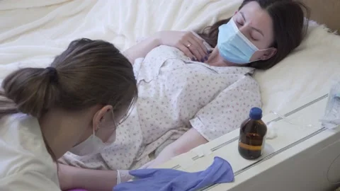 A young nurse puts a drip Video stock 147023858