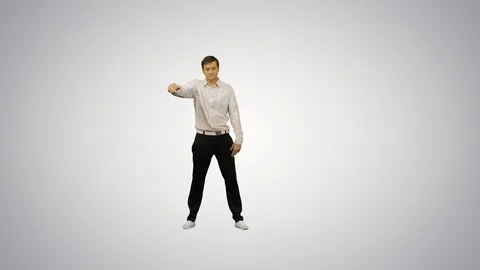 Young office man dancing locking on gradient background. Stock Footage 128652287