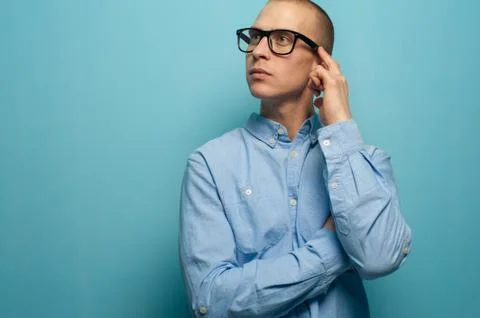 Young office manager guy looking up Stock Photos