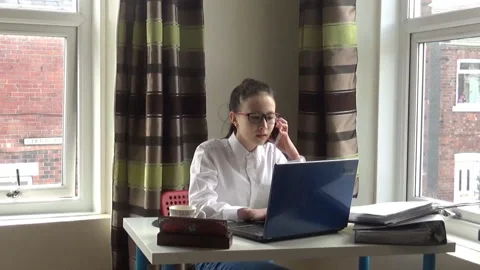 Young office worker calling someone Stock Footage 90393709