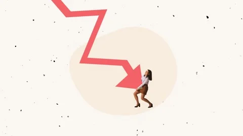 Young office worker, employee trying to prevent falling graph arrow symbolizing Stock Footage 246916674
