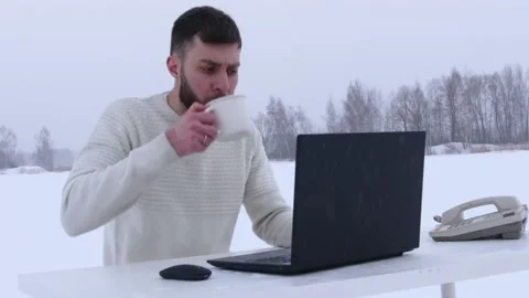 Young office worker in the field. Office manager in the snow. Stock Footage 148432609