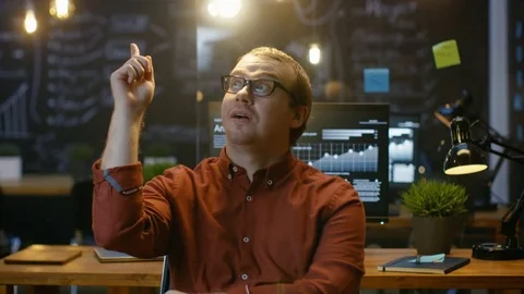 Young Office Worker Has Eureka Moment While Sitting in His Office Thinking. Stock Footage 83158635