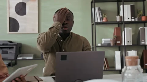 Young Office Worker Making Mistake in Report While Working on Laptop Stock Footage 283763733