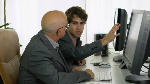 Young Office Worker Showing Idea On Computer To Boss Stock Footage 113275593