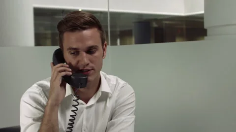Young office worker talking on the phone. Video stock 41266732