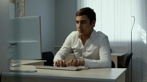 Young office worker typing on wireless keyboard Stock Footage 111938163