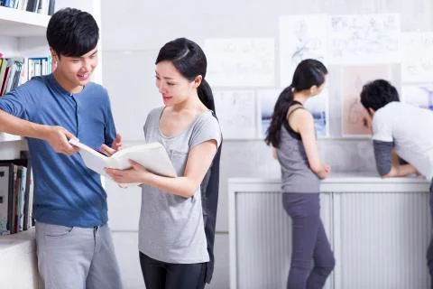 Young office workers in communication Stock Photos