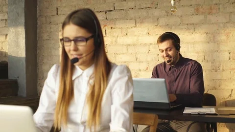 Young office workers using computers in an office Stock Footage 71004167