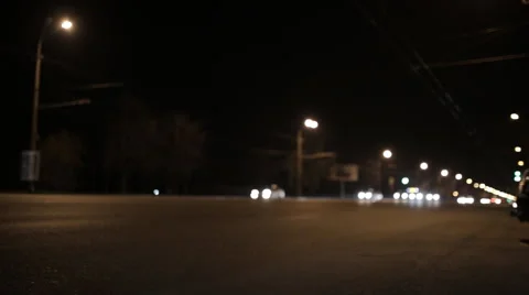 Young operator removes the camera at night road in the city center Stock Footage 60404629