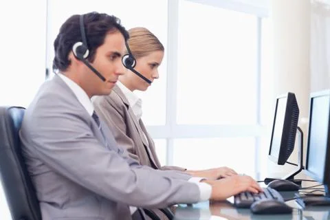 Young operators using a computer 스톡 사진