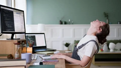 Young overworked freelancer leans back on chair and falls asleep Stock Footage 195414754