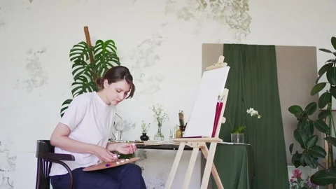 Young painter creative in the studio. Hobby drawing. Work with oil paints Stock Footage 161021414