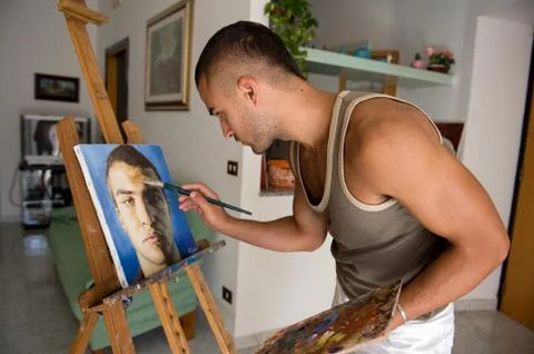 Young painter with his canvas Stock Photos