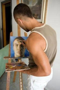 Young painter with his canvas Stock Photos