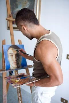 Young painter with his canvas Stock Photos
