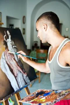 Young painter with his canvas  Stock Photos