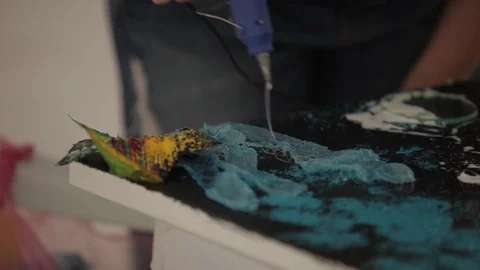 A young painter paste layers Stock Footage 86458243