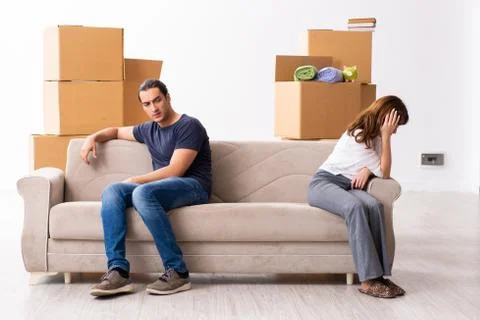 Young pair and many boxes in divorce settlement concept Fotos Stock