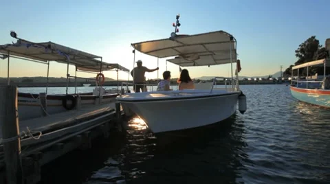 Young pair in the Boat during sunset, Corfu, Greece Stock Footage 7906659