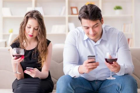 Young pair drinking wine in romantic concept Fotos Stock