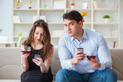 Young pair drinking wine in romantic concept Fotos Stock