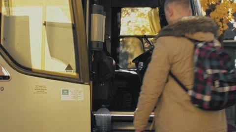 Young pair of tourists get on the bus Stock Footage 138587674