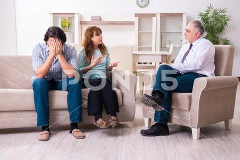 Young pair visiting experienced doctor psychologist Stock Photos