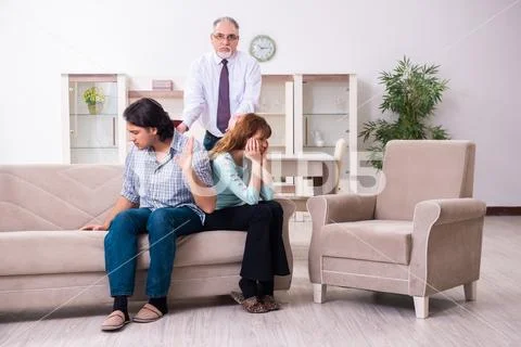 Young pair visiting experienced doctor psychologist Stock Photos
