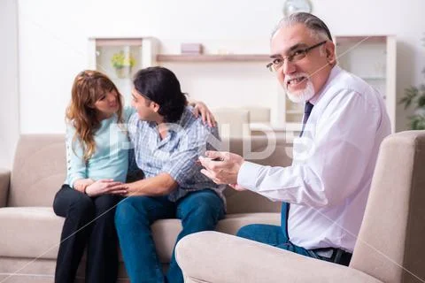 Young pair visiting experienced doctor psychologist Stock Photos