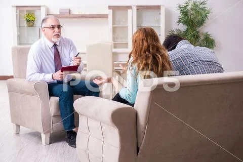 Young pair visiting experienced doctor psychologist Stock Photos
