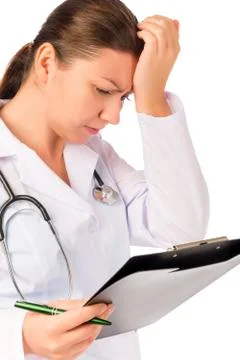 Young paramedic looking for error in the documents Stock Photos