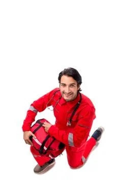 The young paramedic in red uniform isolated on white 스톡 사진