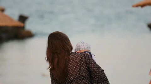 Young parents and their sweet baby looking to sea Stock Footage 12271053