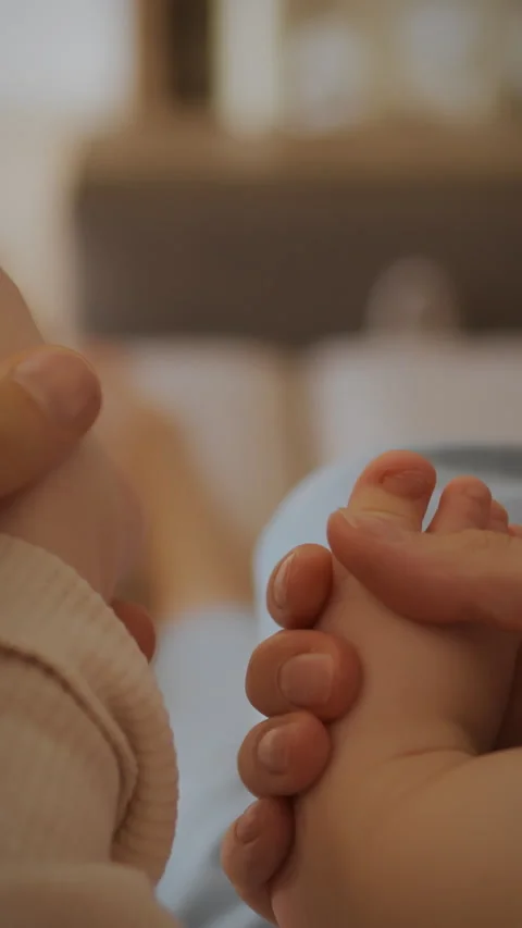 Young parents bonding with their child during a cozy moment at home on the s Stock Footage 331742525