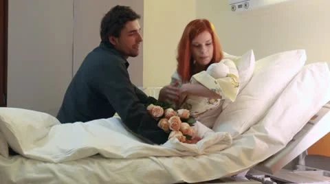 Young parents with newborn baby Stock Footage