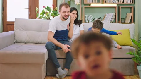 Young parents spending good time with their kids they smiling large chatting and Stock Footage 139048196