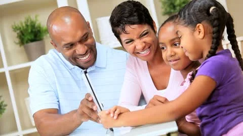 Young Parents Watching Children Using Wireless Tablet Stock Footage 8974252