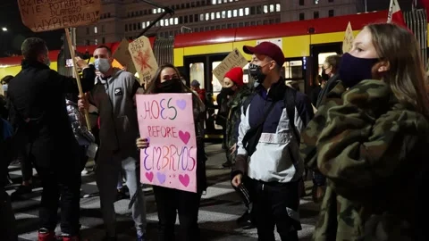 Young participants of pro choice protest dancing in Warsaw, Poland Stock Footage 141971204