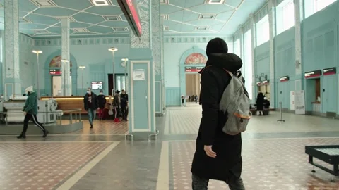 A young passenger walks through the station. Inspects the interior of the Stock Footage 199514763